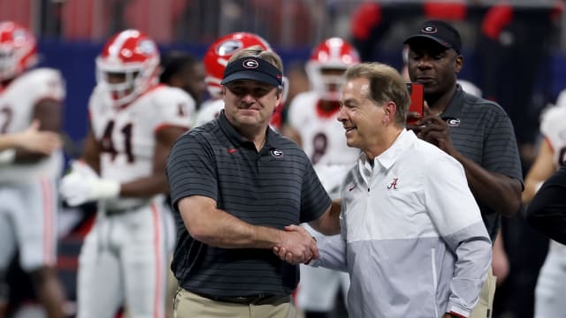 Dec 4, 2021; Atlanta, GA, USA; Georgia Bulldogs head coach Kirby Smart greets Alabama Crimson Tide head coach Nick Saban before the SEC championship game at Mercedes-Benz Stadium.